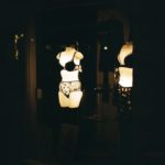 Mannequins display lingerie in a dark store window